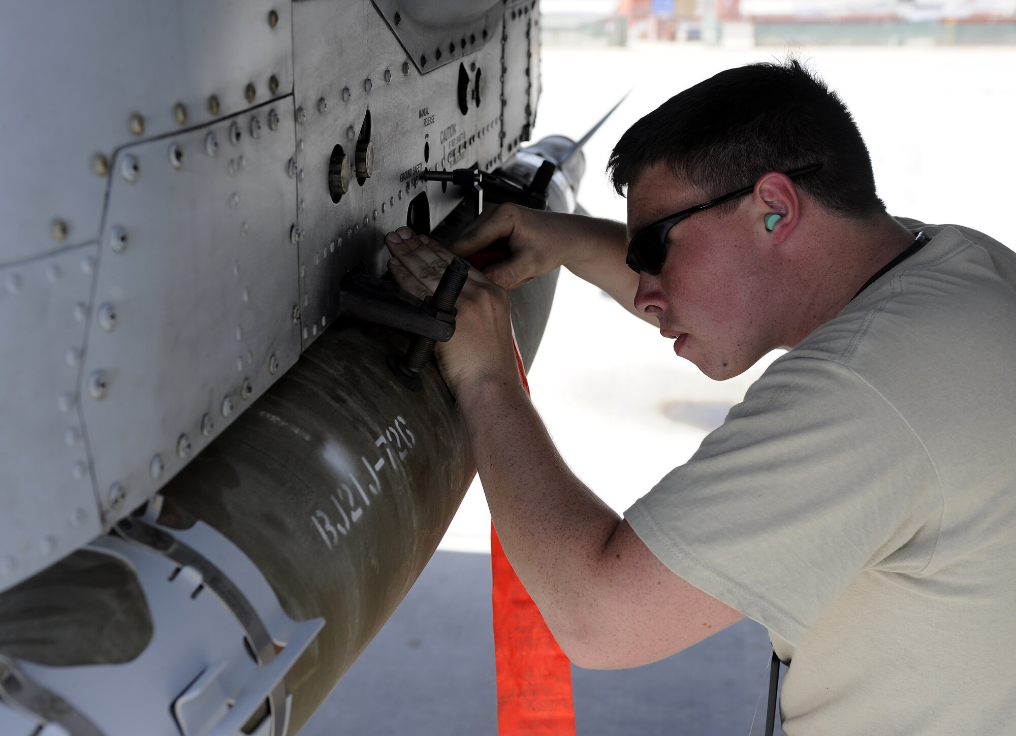 Airman 1st Class Levi Adams conducts preflight load inspections on an A-10C Thunderbolt March 24, 2011, at Kandahar Air Field, Afghanistan. Airman Adams is an A-10 weapons load crew member stationed at Moody Air Force Base, Ga., but currently assigned to the 74th Expeditionary Fighter Squadron. (U.S. Air Force photo/Senior Airman Willard E. Grande II)