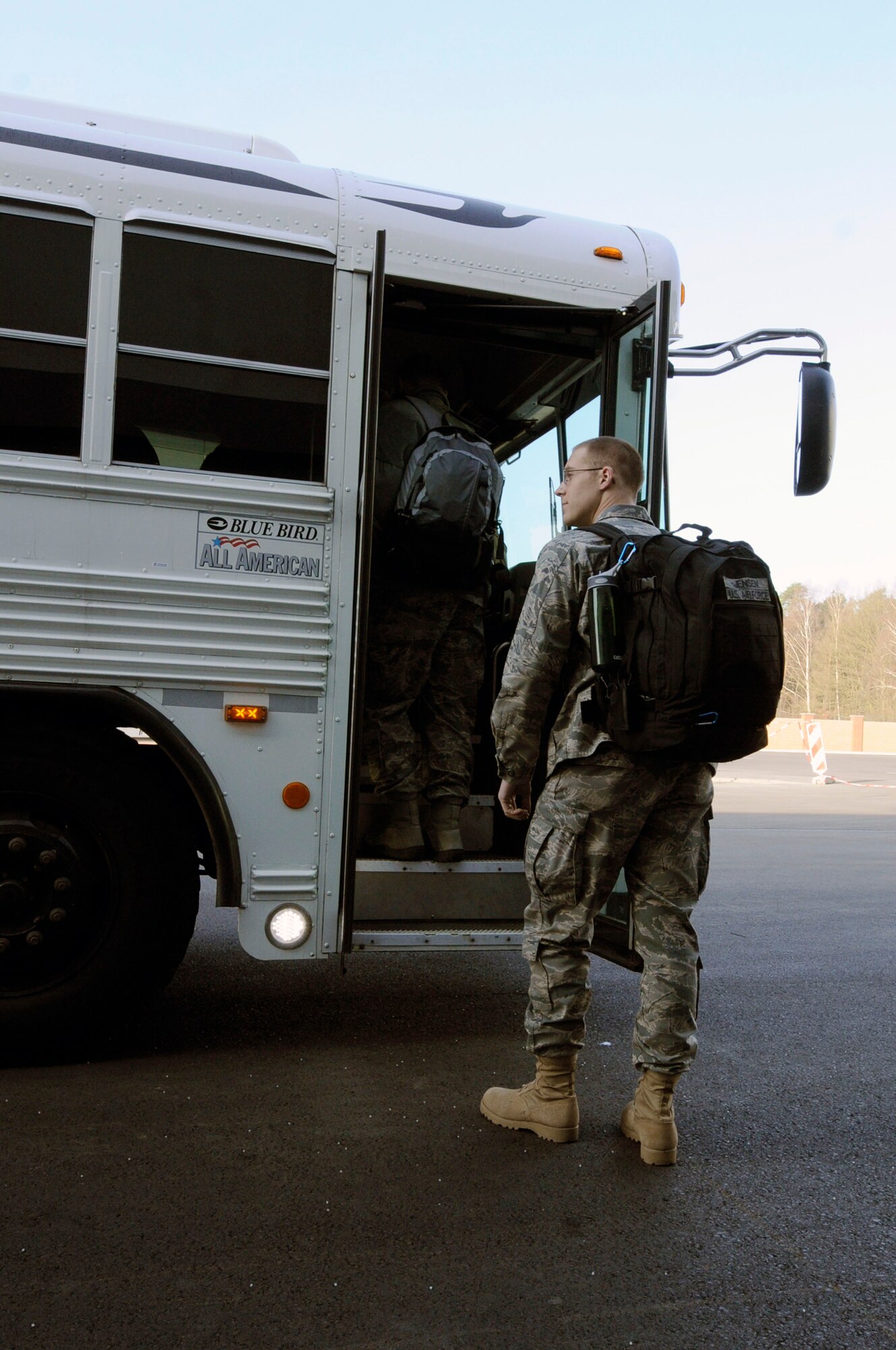 U.S. Air Force 1st Lt. Douglas Jensen, 1st Combat Communications Squadron, loads onto a bus before deploying in support of Joint Task Force Odyssey Dawn, Ramstein Air Base, Germany, March 24, 2011. Joint Task Force Odyssey Dawn is the U.S. Africa Command task force established to provide operational and tactical command and control of U.S. military forces supporting the international response to the unrest in Libya and enforcement of United Nations Security Council Resolution (UNSCR) 1973. UNSCR 1973 authorizes all necessary measures to protect civilians in Libya under threat of attack by Qadhafi regime forces.  JTF Odyssey Dawn is commanded by U.S. Navy Admiral Samuel J. Locklear, III.   (U.S. Air Force photo by Airman Kendra Alba)