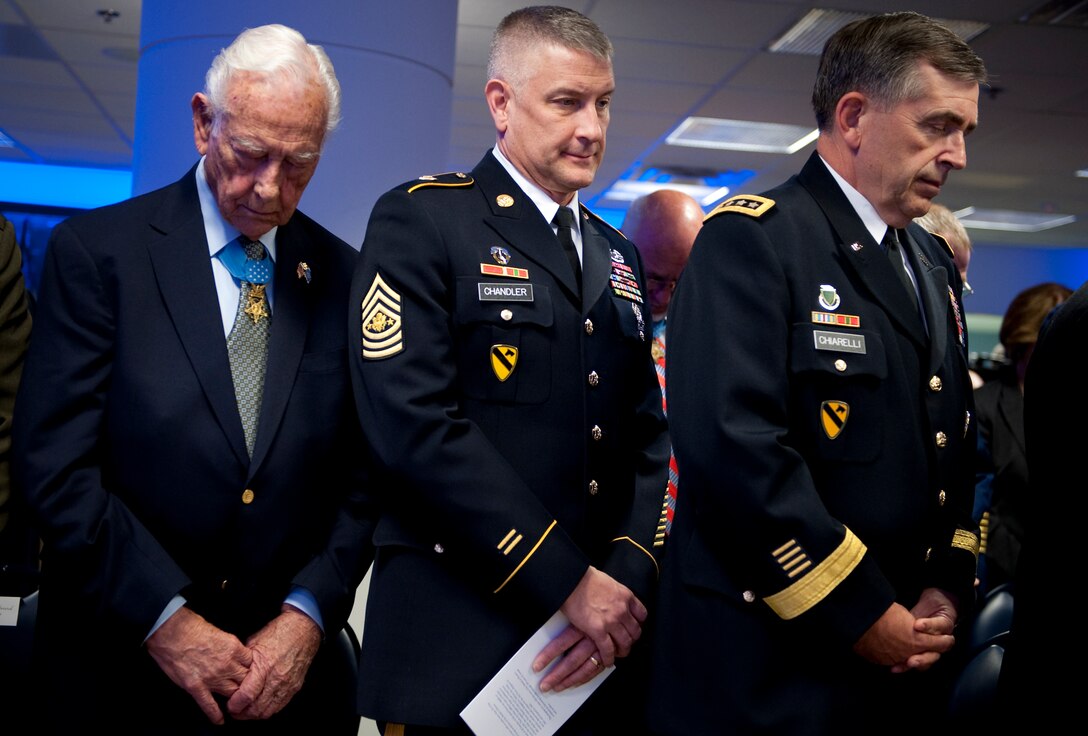 Medal of Honor recipient Walter Ehlers, left, Sergeant Major of the Army Raymond Chandler, center, and Army Gen. Peter Chiarelli, U.S. Army vice chief of staff, pray during the benediction of a ceremony in honor of the 150th anniversary of the Medal of Honor at the Pentagon's Hall of Heroes, Washington, D.C., March 25, 2011.