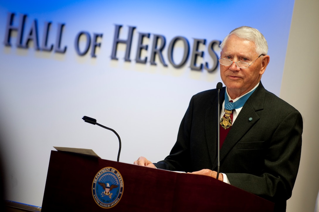 Retired Air Force Col. Leo K. Thorsness, Congressional Medal of Honor Society president, addresses audience members at a ceremony marking the 150th anniversary of the Medal of Honor at the Pentagon's Hall of Heroes, Washington, D.C., March 25, 2011.