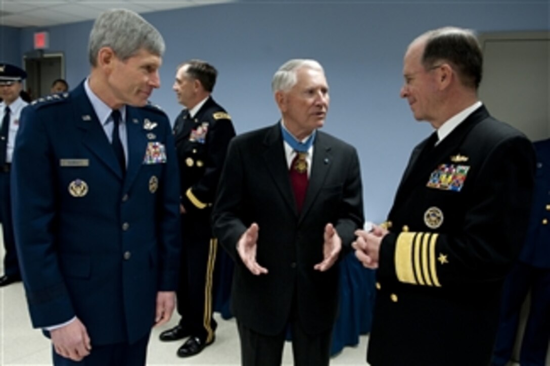 President of the Congressional Medal of Honor Society retired U.S. Air Force Col. Leo K. Thosness speaks with Air Force Chief of Staff Gen. Norton A. Schwartz (left) and Chairman of the Joint Chiefs of Staff Adm. Mike Mullen (right) prior to a ceremony honoring the 150th anniversary of the Medal of Honor in the Hall of Heroes in the Pentagon on March 25, 2011.  