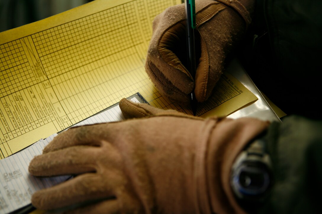 Lance Cpl. Eric M. Wanczak, a Marine Aerial Refueler Transport Squadron 152 loadmaster, calculates weight distribution for a C-130 in preparation for a humanitarian mission to Sendai, Japan, as part of Operation Tomodachi here March 25. Balancing an aircraft requires some mathematical prowess, which loadmasters attain at school where they spend approximately five weeks learning math.