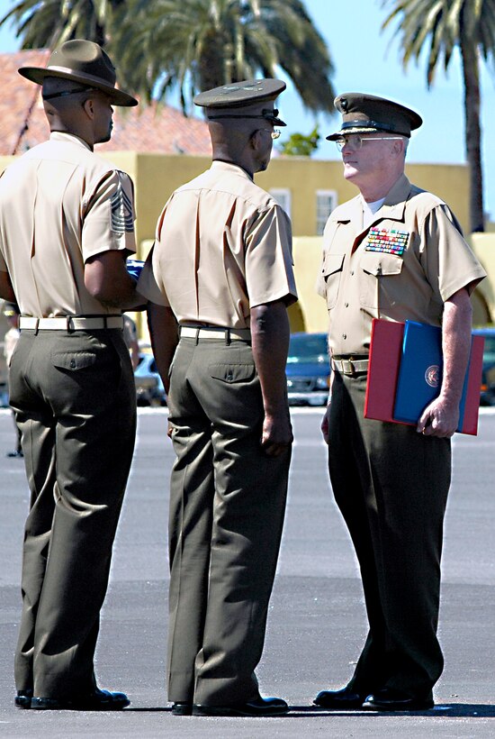Marine Corps Recruit Depot San Diego and Western Recruiting Region Chief of Staff Col. Carl F. Huenefeld, stands before the depot and WRR’s commanding general, Maj. Gen. Ronald L. Bailey, and depot sergeant major, Sgt. Maj. Sylvester D. Daniels, during his formal retirement ceremony. The ceremony was held on the depot’s Shepherd Memorial Field March 25. Huenefeld has honorably served in the Marine Corps since June 1971 and will officially retire July 31.