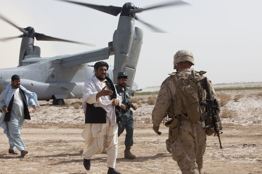 Marjah District Governor Abdul Mutalib Majbor greets Lt. Col. David Hudspeth, the commanding officer of 3rd Battalion, 9th Marine Regiment, before a shura in Southern Marjah District, Helmand province, Afghanistan, which concluded Operation Watchtower, March 25.