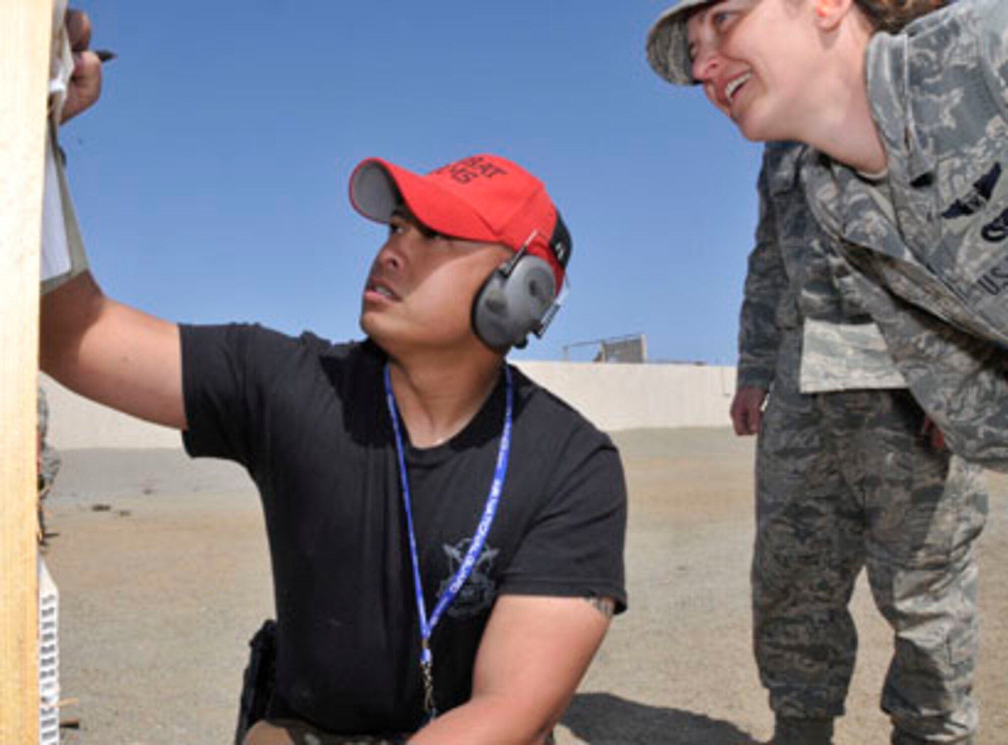 SAN CLEMENTE ISLAND, Calif -- Staff Sgt. Leonard Reloza, a combat arms instructor with the 176th Security Forces Squadron, scores a target board here March 18 for a member of the 176th Civil Engineer Squadron (176 CES).

The 176 CES deployed to this remote island off the coast of southern California for two weeks in March 2011 to train and work on a variety of infrastructure projects. Reloza accompanied the 176 CES members to provide them with annual firearms training, taking advantage of the island's firing ranges.

Alaska Air National Guard photo by Staff Sgt. N. Alicia Goldberger.