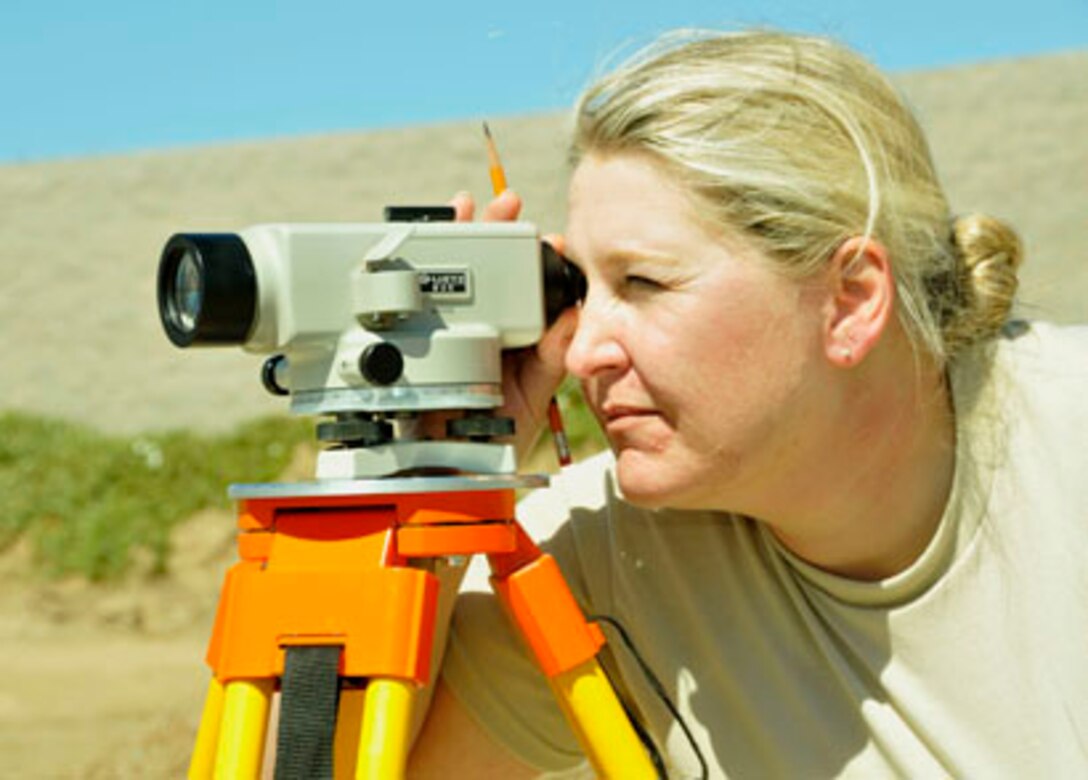 SAN CLEMENTE ISLAND, Calif -- Staff Sgt. Krista Jeppsen, an engineer assistant with the 176th Civil Engineer Squadron, peers into an instrument here March 15 to survey ground.

In March 2011, the 176 CES deployed to this remote location off the coast of southern California for two weeks to train and work on a variety of infrastructure projects. This project required surveying to grade firing lanes at a pistol range. The pistol range was for military training.

Alaska Air National Guard photo by Staff Sgt. N. Alicia Goldberger.