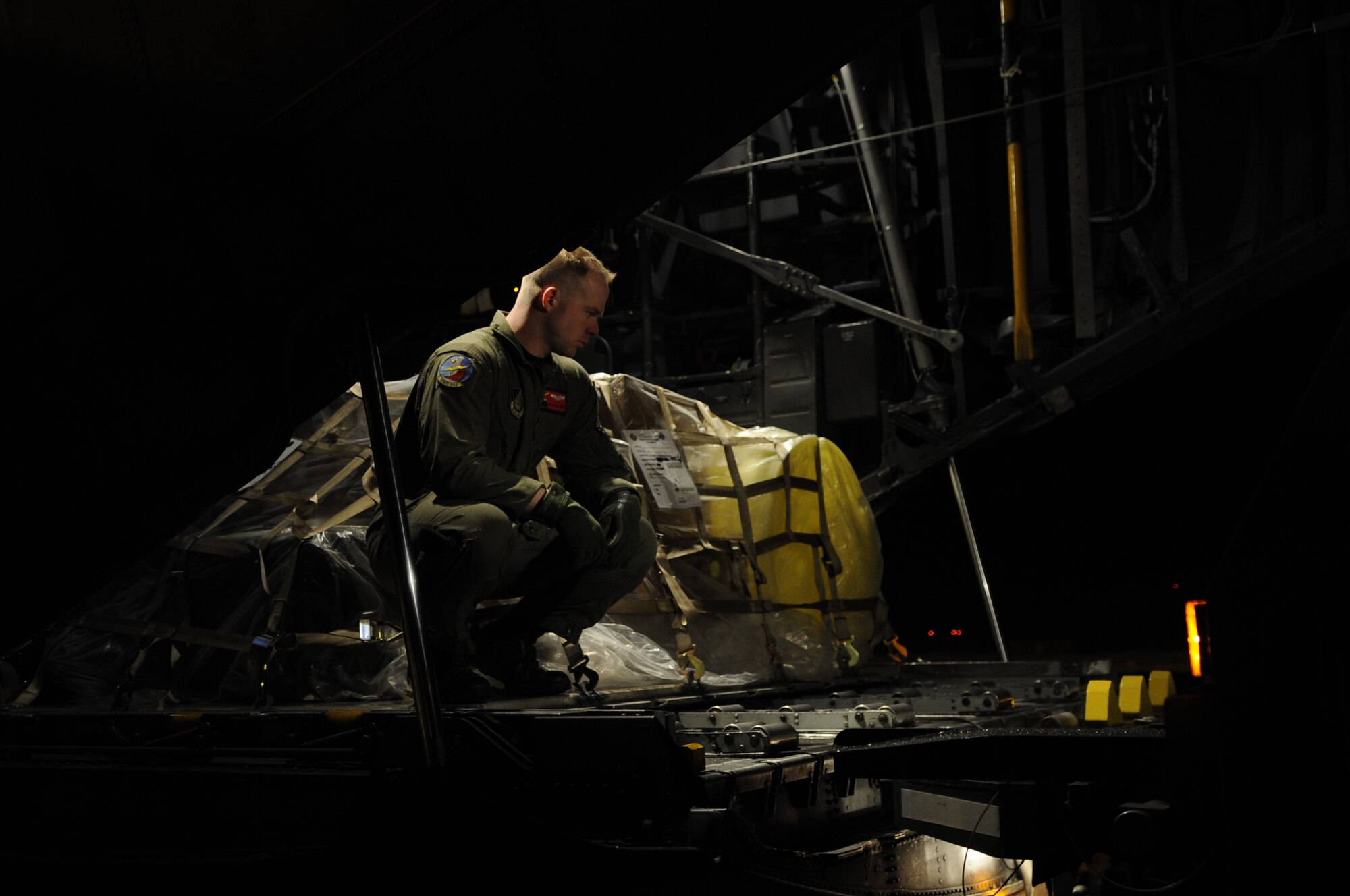 Staff Sgt. Blake Landry, 374th Operational Support Squadron, prepares to offload pallets from a C-130 at Misawa Air Base, Japan, March 26. The pallets contained supplies and equipment in support of Operation Tomodachi. (U.S. Air Force photo by Staff Sgt. Raymond Mills, Released)