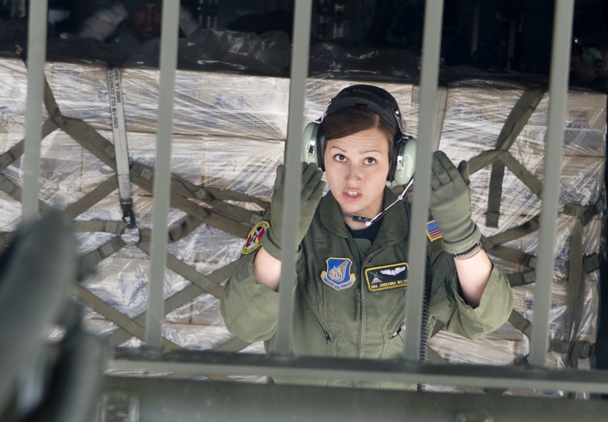 SENDAI AIRPORT, Japan -- Senior Airman Jordanne Willson, 36th Airlift Squadron, guilds a forklift into position to load a pallet of water at Sendai Airport, March 26. The water that was airlifted to Sendai Airport is part of the over 1.5 million pounds of water being moved from Yokota Air Base to Northern Japan in support of Operation Tomodachi. (U.S. Air Force photo by/Master Sgt. Jeromy K. Cross)
