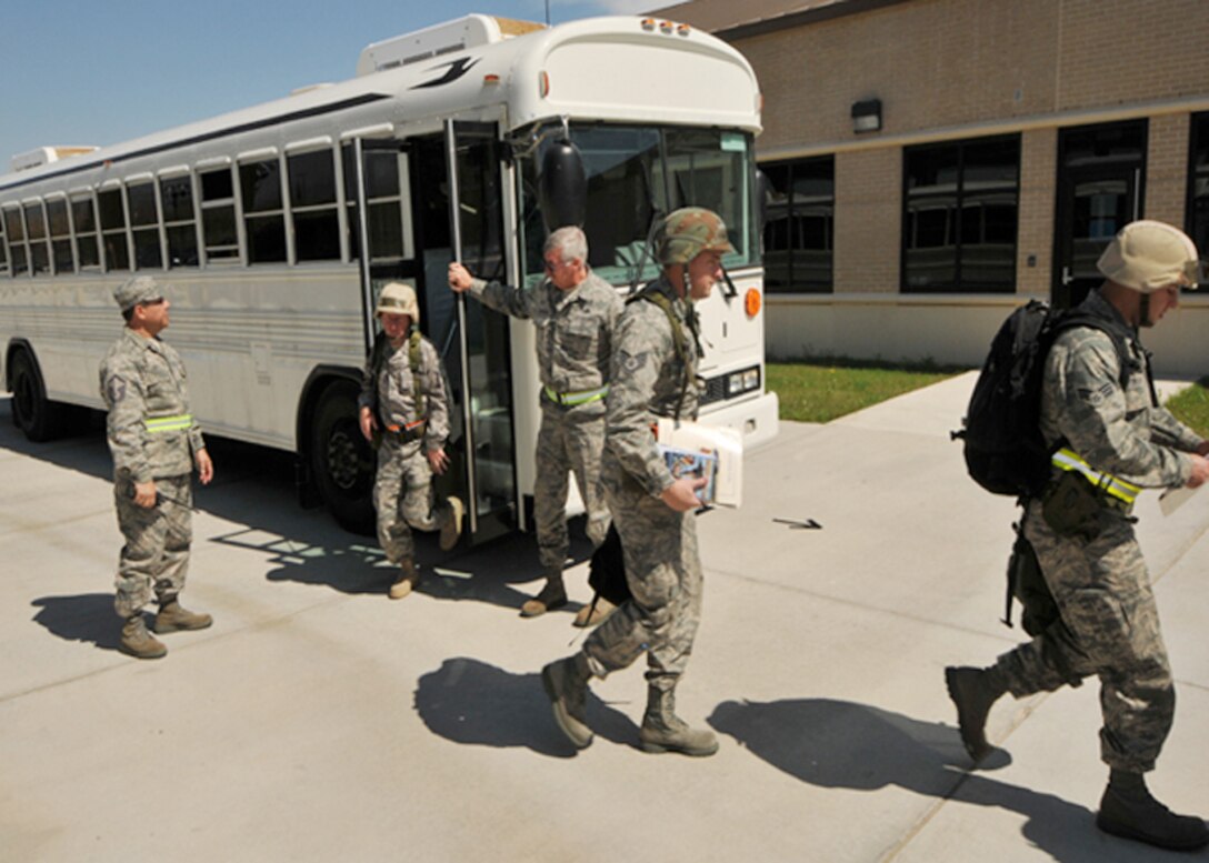 Airman from the 147 Reconnaissance Wing step off a bus to enter the Passenger Deployment Function (PDF) processing line during Operational Readiness Exercise (ORE) Lonestar 11-01  at Ellington Field Joint Reserve Base, Houston, 3 March 2011.  The PDF ensures deploying airman have all their administrative, medical, legal, and financial affairs in order prior to deployment to a combat zone. 147 RW/Photo: MSgt Dale Hanson 



