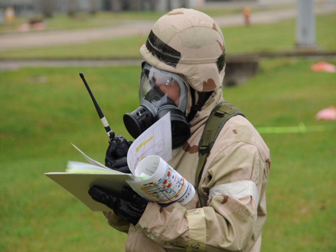 An airman from the 147th Reconnaissance Wing locates  unexploded ordnance on a grid map during a post-attack check for chemical agents and unexploded ordnance during Operational Readiness Exercise (ORE) Lonestar 11-01 at Ellington Field Joint Reserve Base, Houston, 5 March 2011.  The 147th Reconnaissance Wing performed the ORE to exercise deploying and operating from a combat zone.  147 RW/Photo: MSgt Dale Hanson



