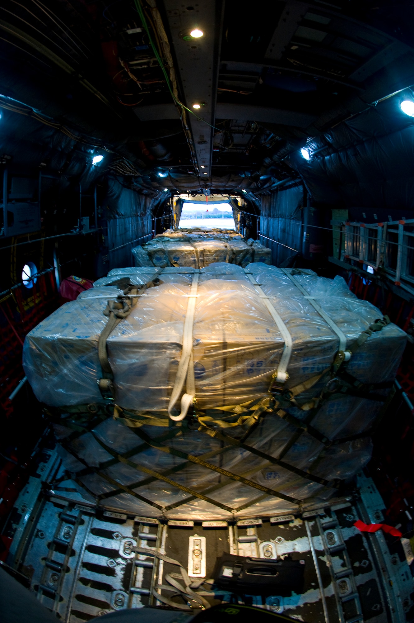 YOKOTA AIR BASE, Japan -- A C-130 full of water pallets waits to take off here, March 25. The 36th Airlift Squadron is part of an airlift effort to move more than 1.5 million pounds of water in support of Operation Tomodachi. (U.S. Air Force photo by/Master Sgt. Jeromy K. Cross)
