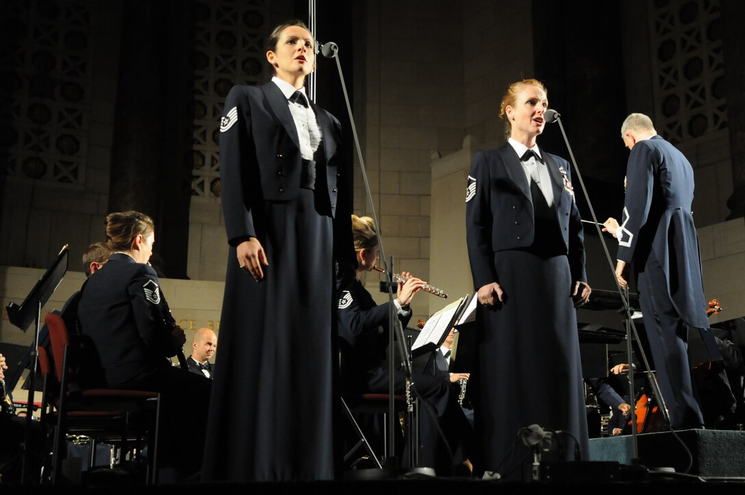 Tech. Sgt. Emily Lewis and Master Sgt. Anne Baker perform “Opera Live” during the 2010 fall tour. This April, the Concert Band and Singing Sergeants will embark on a 19-day tour through the states of Oklahoma, Texas and Louisiana. All of the concerts will be free and open to the public, but do require tickets. The latest information concerning ticket distribution for each performance will be posted on our website calendar. (Photo by Senior Airman Christopher Ruano)