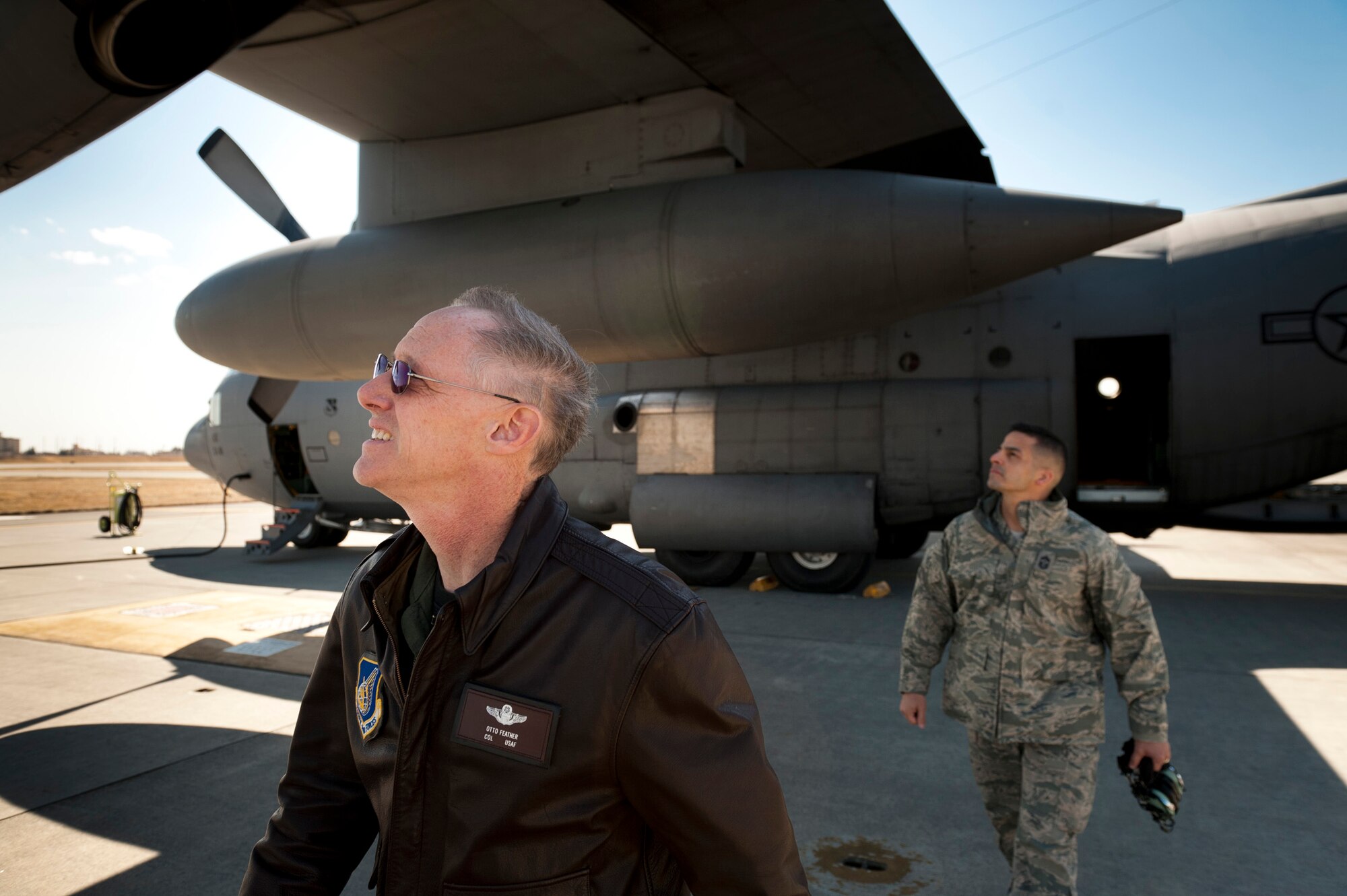 YOKOTA AIR BASE, Japan -- Col. Otto Feather and Chief Master Sgt. Benjamin Caro Jr. perform a preflight walk-around on a C-130H Hercules at Yokota Air Base, Japan, March 26, 2011. Colonel Feather, 374th Airlift Wing commander, flew five pallets of potable water to Sendai Airport to be distributed to Japanese citizens in need. Chief Caro, 374th AW command chief master sergeant, accompanied him to see the devastation caused by the March 11 earthquake and tsunami, as well as meet the Airmen helping to rebuild the eastern coast of Japan. (U.S. Air Force photo/Staff Sgt. Samuel Morse)
