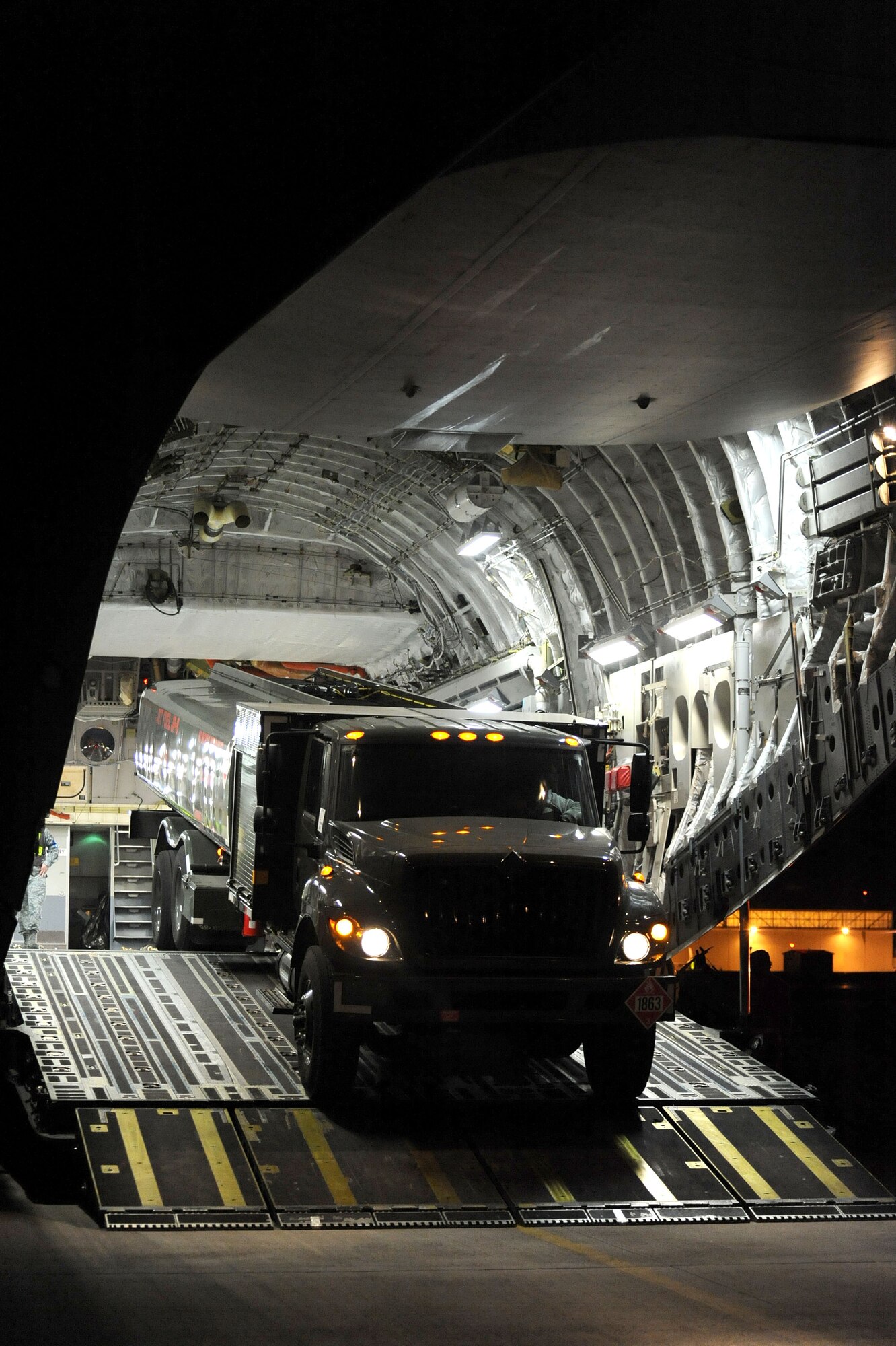 Loadmasters prepare to unload an R11 refueler truck from a Spangdahlem Air Base, Germany, C-17 Globemaster III March 23, 2011, at Aviano Air Base, Italy, in support of Operation Odyssey Dawn. Joint Task Force Odyssey Dawn is the U.S. Africa Command task force established to support the larger international response to the unrest in Libya. A broad coalition of nations are partnering to enforce U.N. Security Council Resolution (UNSCR) 1973, which authorizes all necessary means to protect civilians in Libya under threat of attack by Qadhafi regime forces.  JTF Odyssey Dawn is commanded by Admiral Samuel J. Locklear, III.  (US Army Photo by SSG Tierney P. Wilson) 