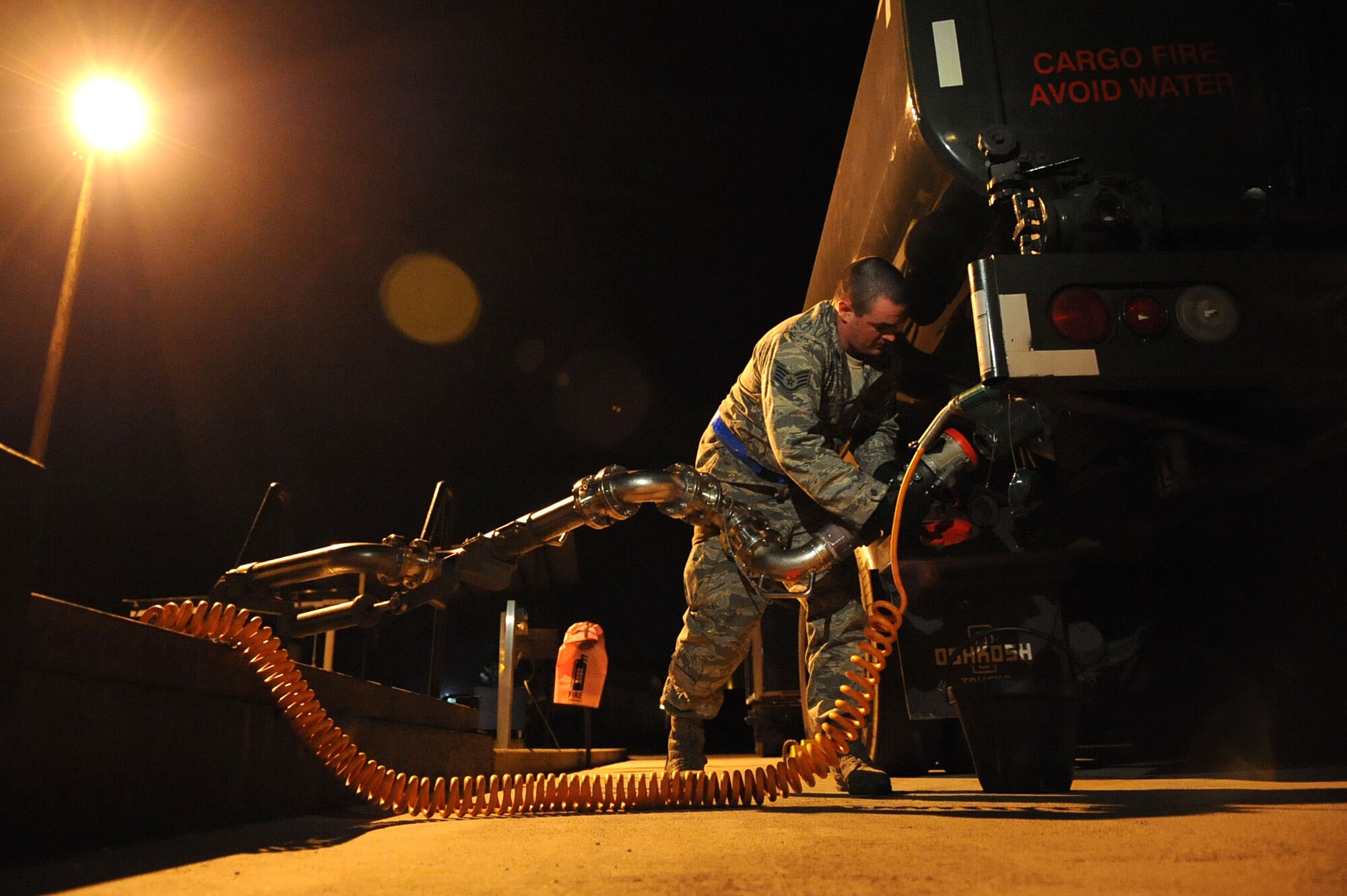 Staff Sgt. Bronson Clontz, a fuels specialist with 48th Logistics Readiness Squadron at Royal Air Force Lakenheath, England, refuels an R11 refueler truck in preparation of incoming aircraft at Aviano Air Base, Italy, in support of Operation Odyssey Dawn. Joint Task Force Odyssey Dawn is the U.S. Africa Command task force established to support the larger international response to the unrest in Libya. A broad coalition of nations are partnering to enforce U.N. Security Council Resolution (UNSCR) 1973, which authorizes all necessary means to protect civilians in Libya under threat of attack by Qadhafi regime forces.  JTF Odyssey Dawn is commanded by Admiral Samuel J. Locklear, III.  (US Army Photo by SSG Tierney P. Wilson) 