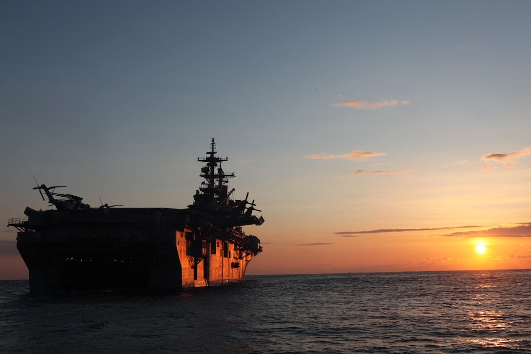 The USS Essex (LHD 2), with the 31st Marine Expeditionary Unit aboard, nears the coast of Japan at sunrise, March 27.  The 31st MEU and Amphibious Squadron 11 delivered food, water, comfort items and commercial repair vehicles to residents on the isolated island of Oshima using U.S. Navy landing craft, demonstrating the MEU’s expeditionary capabilities in ship-to-shore amphibious operations. Marines and Sailors of the 31st MEU are conducting humanitarian aid and disaster relief missions in northeast Japan in coordination with the Japanese Self Defense Forces.