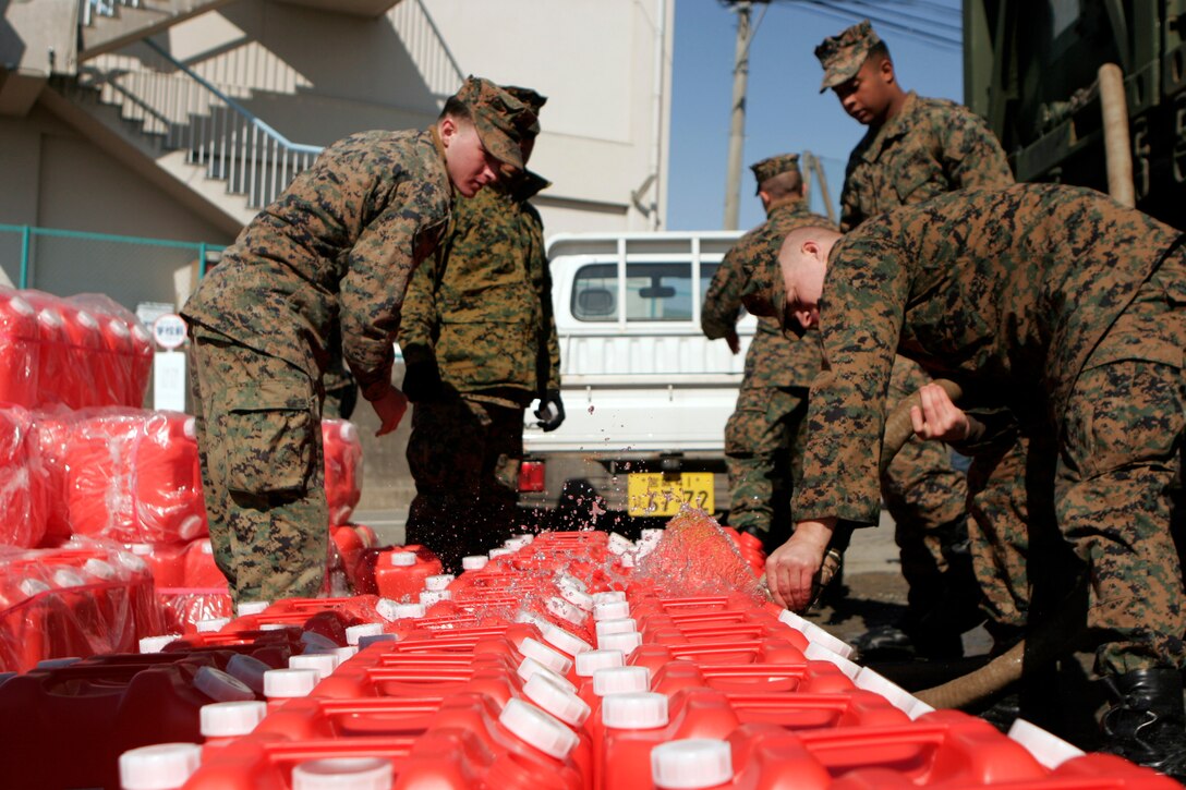 Marines with the 31st Expeditionary Unit fill more than 100 water jugs for to be distributed to local Japanese people here, March 27. The MEU also delivered food, health and comfort supplies, and Japanese electrical utility vehicles to the isolated island of Oshima, in conjunction with Japanese Self-Defense Forces. The 31st MEU’s involvement is part of a larger U.S. government response, after a 9.0 earthquake and subsequent tsunami struck Japan causing widespread damage. The 31st MEU is ready to support our Japanese partners and to provide assistance when called upon.