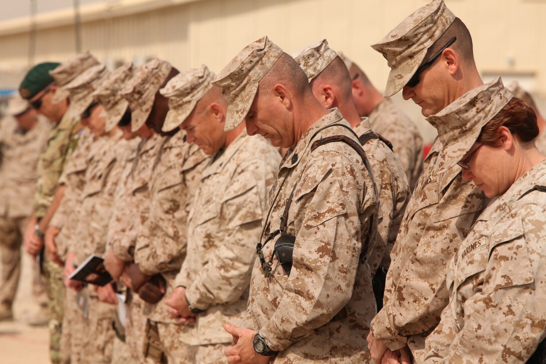 Marines and Sailors bow their heads during the chaplain’s invocation at Marine Wing Support Squadron 373’s transfer of authority to MWSS-272 at Camp Leatherneck, Afghanistan, March 27. The transfer of authority ceremony not only symbolized the end of MWSS-373’s operational responsibilities in support of Regional Command Southwest, but served as a beginning to MWSS-272’s commitment in support of 2nd Marine Aircraft Wing (Forward) and its coalition partners in Afghanistan.