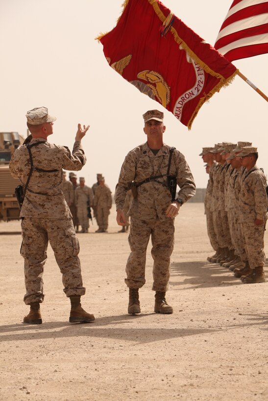 Lt. Col. Dale R. Kruse, the commanding officer of Marine Wing Support Squadron 272, and Sgt. Maj. Robert A. Allen, the squadron’s sergeant major, uncase the battle colors during MWSS-373’s transfer of authority to MWSS-272 at Camp Leatherneck, Afghanistan, March 27.The transfer of authority ceremony not only symbolized the end of MWSS-373’s operational responsibilities in support of Regional Command Southwest, but served as a beginning to MWSS-272’s commitment in support of 2nd Marine Aircraft Wing (Forward) and its coalition partners in Afghanistan.