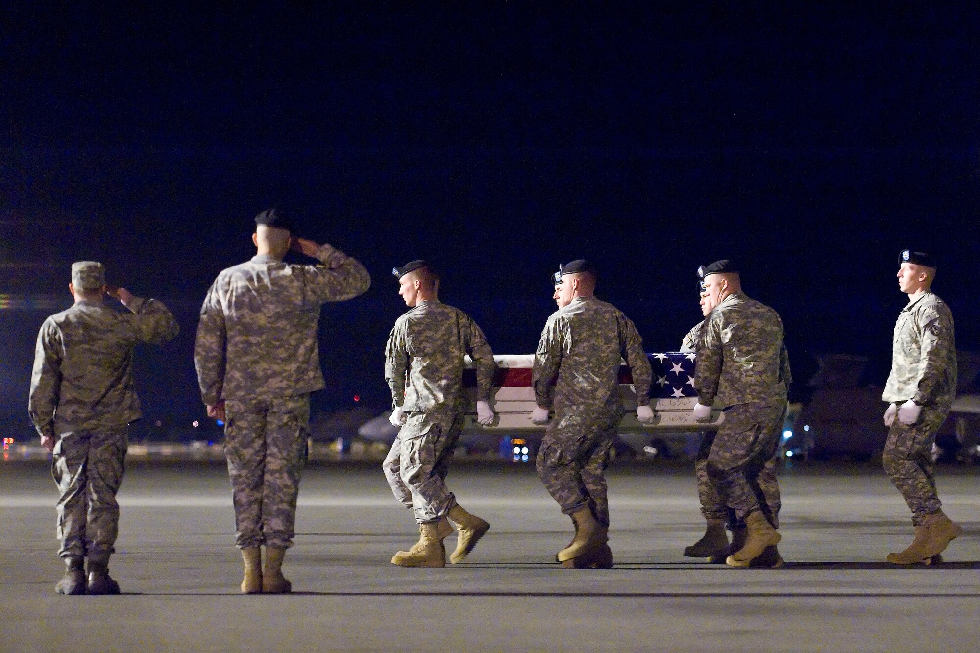 A U.S. Army carry team transfers the remains of Army Spc. Justin D. Ross, of Green Bay, Wis., at Dover Air Force Base, Del., March 27, 2011. Ross was assigned to the 863rd Engineer Battalion, Wausau, Wis. (U.S. Air Force photo/Roland Balik)