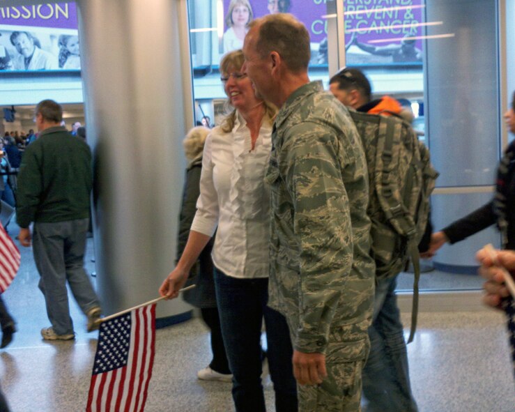 914th Airlift Wing Commander Col. Allan L. Swartzmiller is met by friends and family at the Buffalo Airport, March 26, 2011, Buffalo, NY. Col. Swartzmiller is returning from a deployment to an undisclosed location in south west Asia. (Courtesy photo by Cal Pitruzzella) 