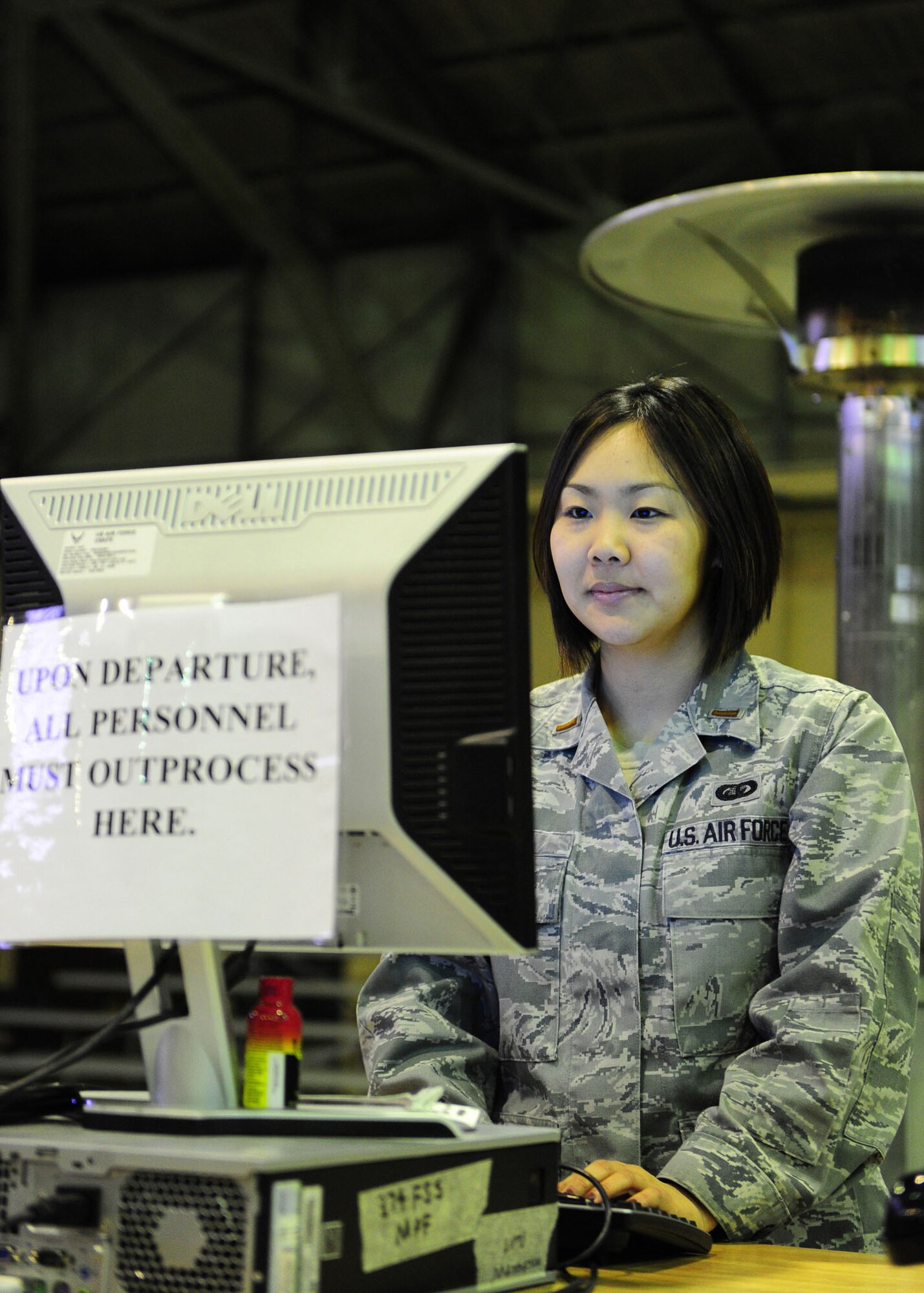 YOKOTA AIR BASE, Japan -- 1st Lt. Angela Cho, 374th Force Support Squadron, tracks deployed personnel information here March 27, 2011. The Greenbelt, Md., native is stationed in Japan and is the nightshift reception processing line OIC. The RPU line has currently processed over 1,500 incoming personnel that are currently supporting Operation Tomodachi. (U.S. Air Force photo/Airman 1st Class Andrea Salazar)