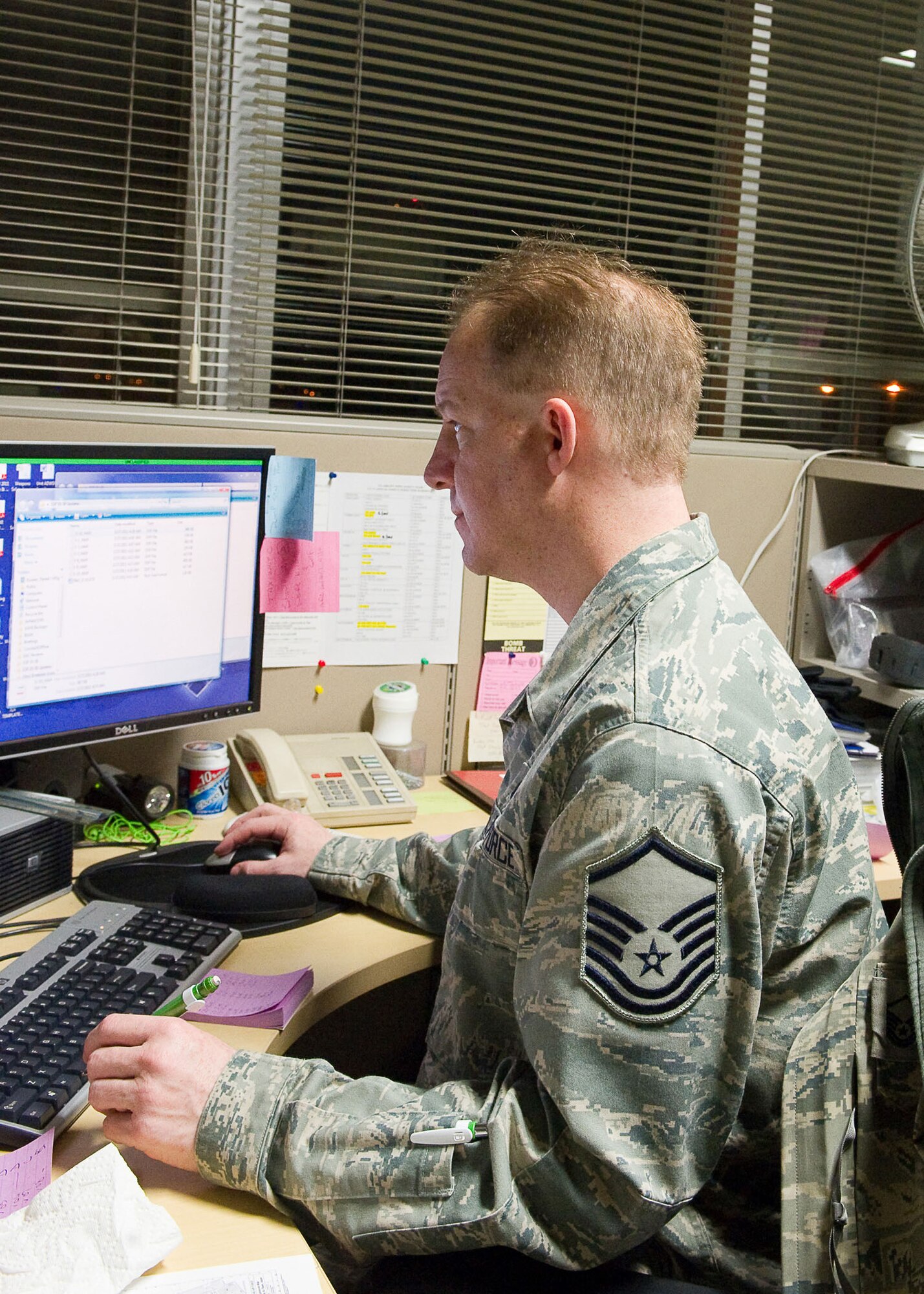 YOKOTA AIR BASE, Japan -- Master Sgt. Daniel Koreen, 374th Airlift Wing weapons safety superintendent, updates information to a database that is used to create and track site plans here March 27, 2011. The Detroit, Mich., native is stationed in Japan and is currently supporting Operation Tomodachi. The operation is a combined effort between American forces and Japanese officials to support Japan's request for humanitarian assistance. (U.S. Air Force photo/Airman 1st Class Andrea Salazar)