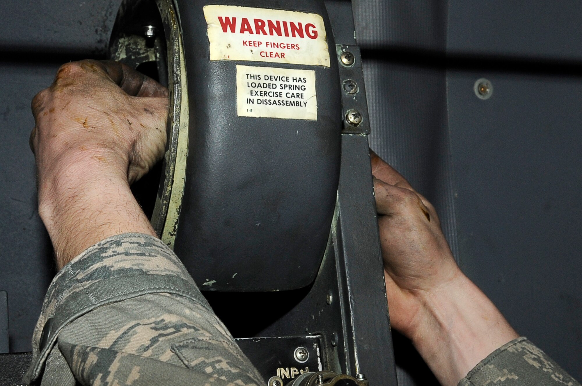 YOKOTA AIR BASE, Japan -- Airman 1st Class Dustin Lingel, 374th Aircraft Maintenance Squadron, works on a negator spring on a C-130 at Yokota March 23. The Airmen assigned to the 374th Airlift Wing are committed to providing support during ongoing disaster relief operations. (U.S. Air Force photo/Master Sgt. Jeromy K. Cross)








