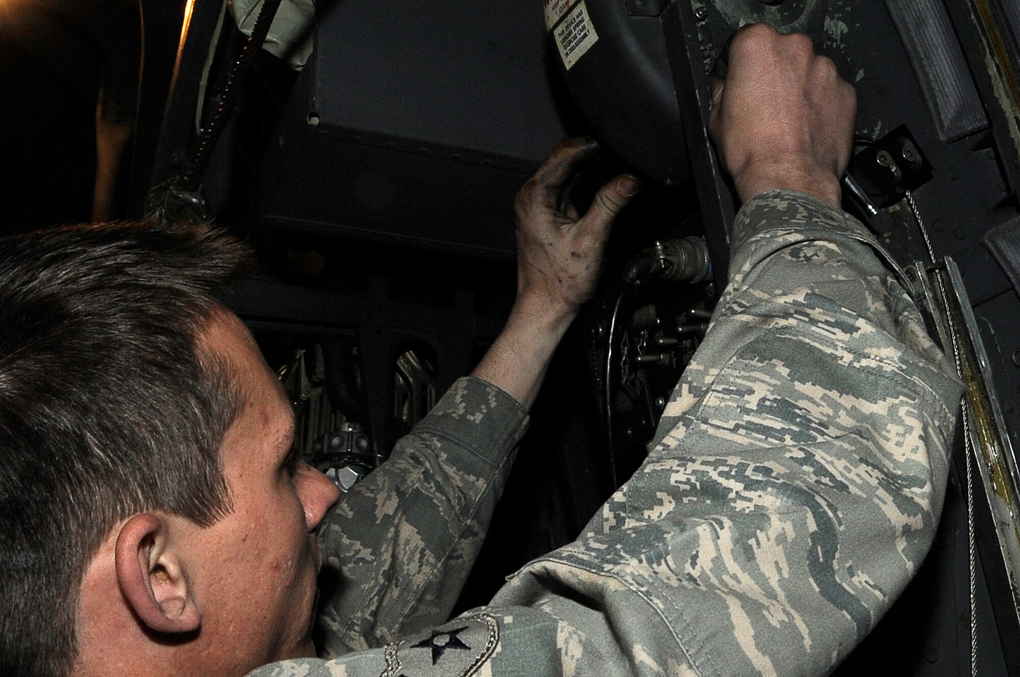 YOKOTA AIR BASE, Japan -- Airman 1st Class Dustin Lingel, 374th Aircraft Maintenance Squadron, fixes a negator spring on a C-130 at Yokota March 23. The Airmen assigned to the 374th Airlift Wing are committed to providing support during ongoing disaster relief operations. (U.S. Air Force photo/Master Sgt. Jeromy K. Cross)








