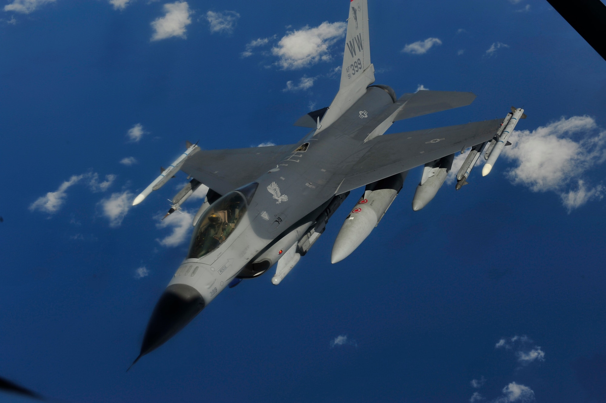 An F-16 Fighting Falcon from the 14th Fighter Squadron, Misawa Air Base, departs to Kunsan Air Base, after receiving fuel from a KC-135 Stratotanker from the 909th Air Refueling Squadron, Kadena Air Base, while flying over the Sea of Japan March 27.  The 14 FS is conducting a routine operational training deployment to Kunsan AB, Republic of Korea for the next few weeks. The KC-135 provides aerial refueling support to Air Force, Navy and Marine Corps aircraft as well as aircraft of allied nations. It is also capable of transporting litter and ambulatory patients using patient support pallets during aeromedical evacuations. (U.S. Air Force photo/ Staff Sgt. Lakisha A. Croley)