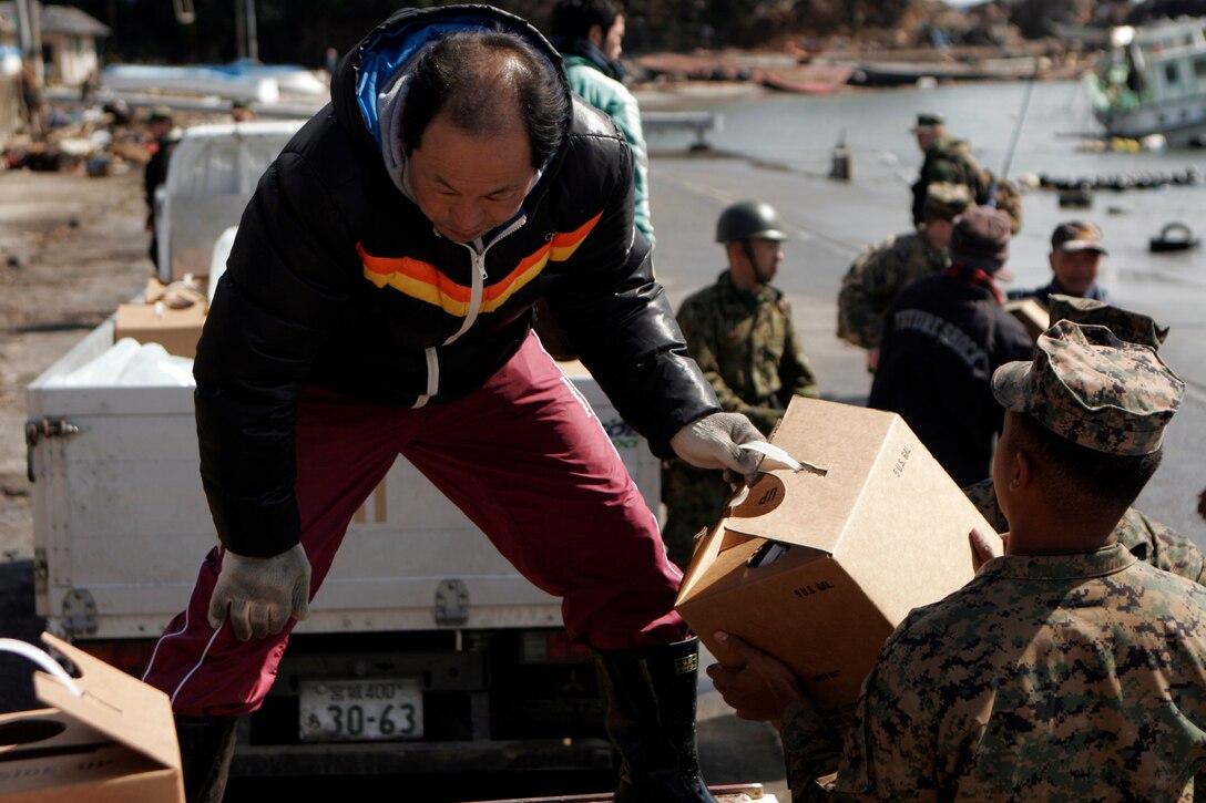 A Marine with the 31st Marine Expeditionary Unit helps a local Japanese man load water onto a truck, March 27. The 31st Marine Expeditionary Unit delivered food, water, health and comfort supplies, and Japanese electrical utility vehicles to the isolated island of Oshima, in conjunction with Japanese Self-Defense Forces. The 31st MEU’s involvement is part of a larger U.S. government response, after a 9.0 earthquake and subsequent tsunami struck Japan causing widespread damage. The 31st MEU is ready to support our Japanese partners and to provide assistance when called upon.