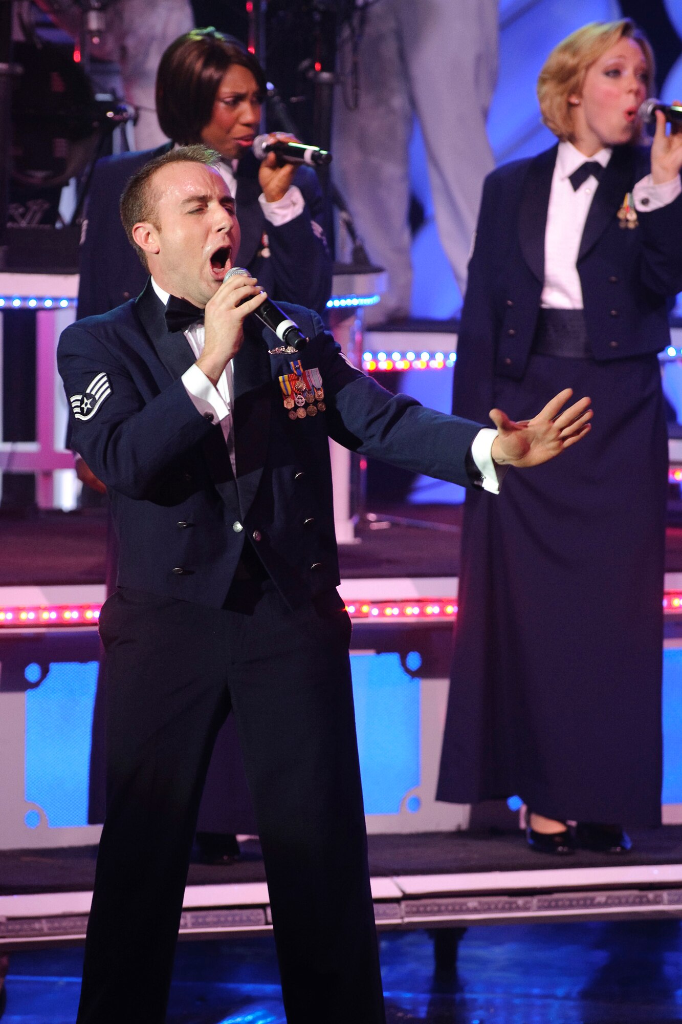 Staff Sgt Steven Sonnier, vocalist with Tops In Blue performs during the final concert of the 2010 "We Believe" tour held at the Laurie Auditorium located on Trinity University, San Antonio, Texas, March 27. 
(U.S. Air Force photo/Steve Thurow)