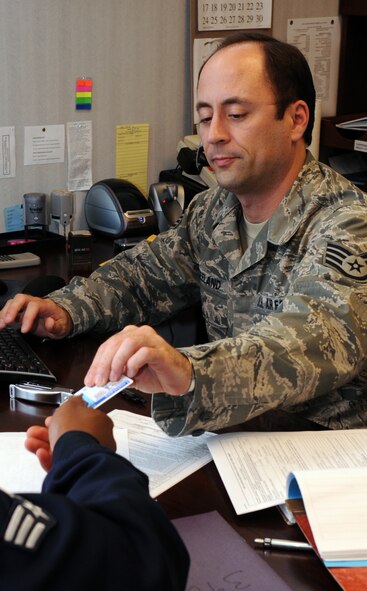 Staff Sgt. Wayne Freeland, 2nd Bomb Wing Legal Office, assists a client in preparing a Power of Attorney at the Barksdale Legal Office March 28. The legal office has improved their legal services through their online Web site. The Web site allows clients to generate their own documents and come in and get them notarized. This process allows for faster service at the legal office. Visit the legal office online at https://aflegalassistance.law.af.mil. (U.S. Air Force photo/ Senior Airman La'Shanette V. Garrett)(RELEASED)