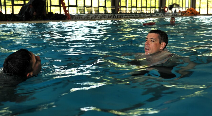 MOODY AIR FORCE BASE, Ga.-- Master Sgt. Michael Haytack, 7th Air Support Operations Squadron operations super, Ft. Bliss TX. gives word of encouragement to a trainee who was struggling with one of the tasks during water confidence training March 23. One of the most challenging portions of the air liaison officer training course is the water confidence. (U.S. Air Force photo/Airman 1st Class Joshua Green)(RELEASED)
