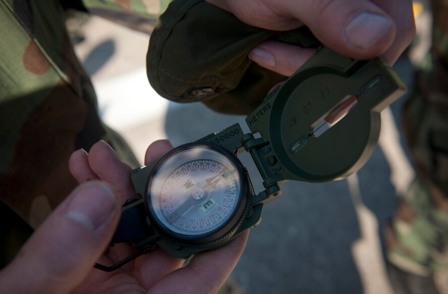 MOODY AIR FORCE BASE, Ga.-- A trainee gives a compass one last look over before turning it in during an equipment check March 25. After completing their task, trainees had to return for a board meeting and see if they were recommended for the air liaison officer training school. (U.S. Air Force photo/Airman 1st Class Joshua Green)(RELEASED)
