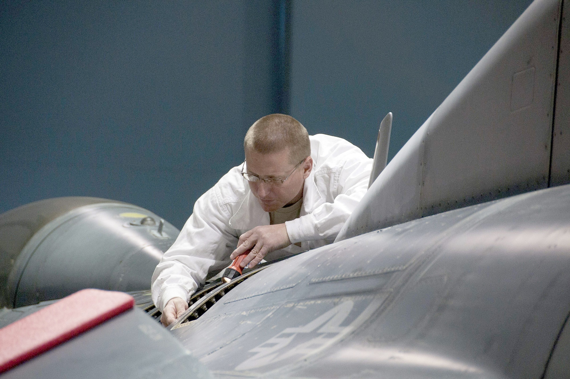 Staff Sgt. Ramey Hubbard completes an inspection after making fuel leak repairs on an F-16 Fighting Falcon March 5, 2011, at the 162nd Fighter Wing in Tucson, Ariz. Aircraft maintainers like Hubbard are embracing Maintenance Resource Management at an increasing rate to reduce the human factor in preventable mishaps. (U.S. Air Force photo/Tech. Sgt. Hollie Hansen)
