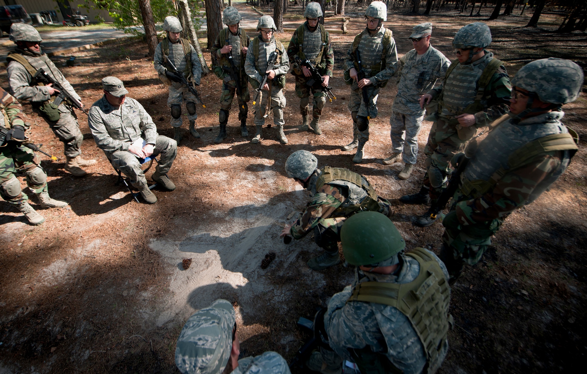 MOODY AIR FORCE BASE, Ga.-- Trainees participating in the air liaison officer training course explain to one of the cadre their plan of action during a combat exercise at the military operations in urban terrain village training facility March 24. The trainees were tasked with a mission that involved clearing buildings and finding a wingman left behind. (U.S. Air Force photo/Airman 1st Class Joshua Green)(RELEASED)
