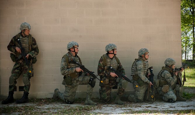 MOODY AIR FORCE BASE, Ga. -- Trainees stack up against a brick wall during a combat training exercise at the military operations in urban terrain village training facility March 24. Trainees participated in the air liaison officer training as a preliminary course to the school they’ll attend if recommended. (U.S. Air Force photo/Airman 1st Class Joshua Green)