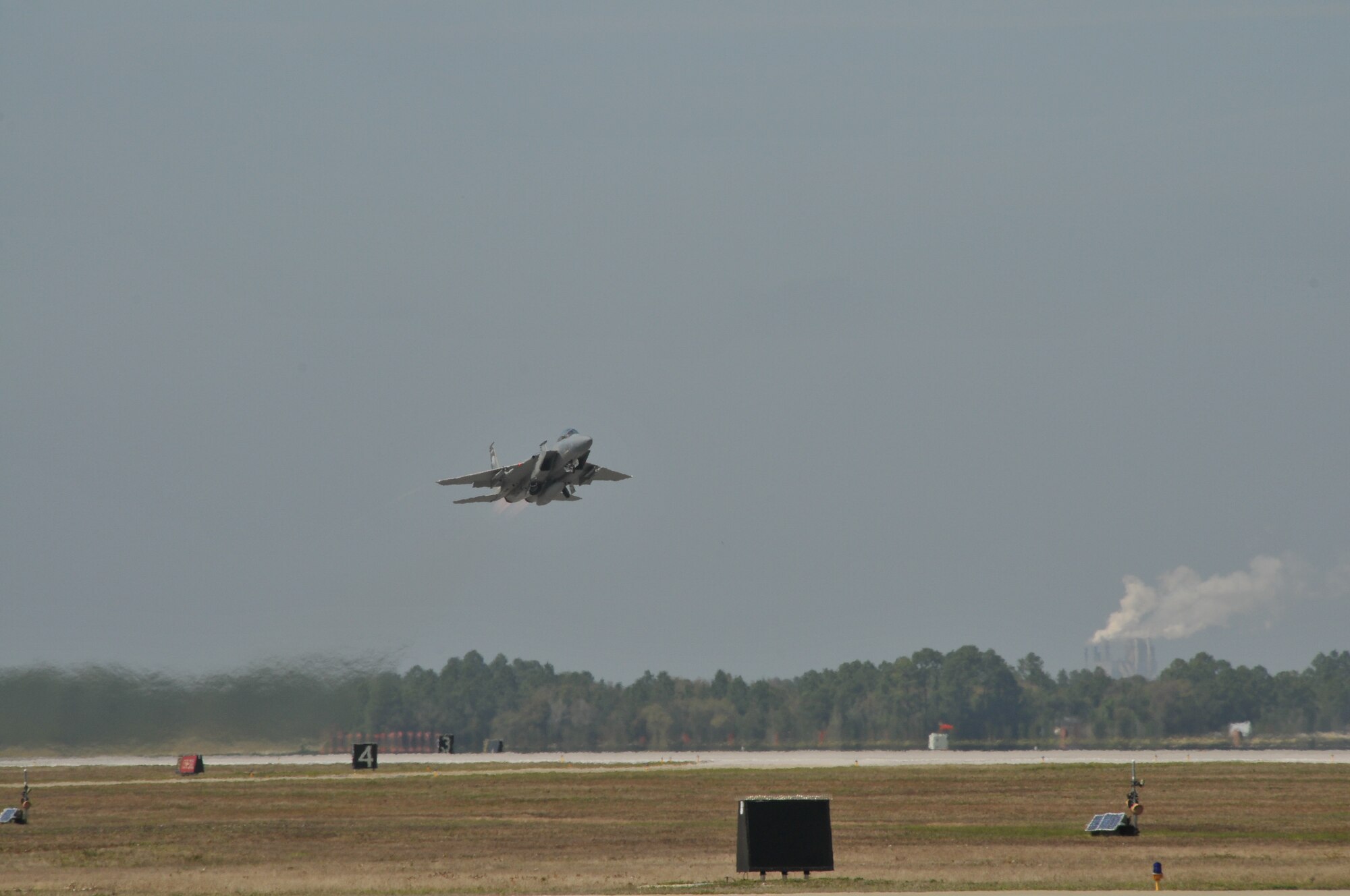 A 114th Fighter Squadron jet roars down the Tyndall AFB runway in afterburner during air exercises at Tyndall AFB, Fla. March 22, 2011. The Kingsley aircraft participated in dissimilar combat training with F-22 Raptor students for the third week in March.  Next week they are scheduled to participate in the Weapons Systems Evaluation Program (WSEP) where pilots will fire live air-to-air missles at unmanned drones over the Gulf of Mexico. (U.S. Air Force photo by Tech. Sgt. Jefferson Thompson) RELEASED