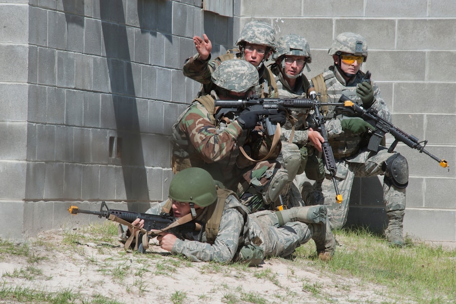 MOODY AIR FORCE BASE, Ga. -- One of the teams that made up the air liaison officer participants discuss their next plan of attack on the opposing forces building March 24. Each team had a leader that controlled their squad and issued orders building on their leadership potential which was one of the many points of the exercise. (U.S. Air Force photo/Airman 1st Class Nicholas Benroth)(RELEASED)
