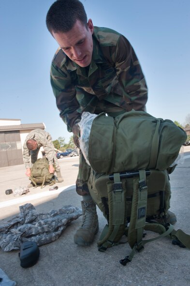 MOODY AIR FORCE BASE, Ga. -- The participants of the air liaison officer course begin to unpack their “ruck” sacks during their gear turn in March 25. The group went piece by piece ensuring everything was in working order before turning it all back it.(U.S. Air Force photo/Airman 1st Class Nicholas Benroth)(RELEASED)
