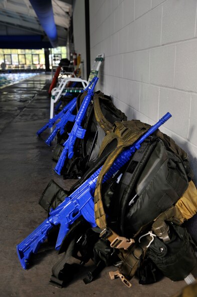 MOODY AIR FORCE BASE, Ga. -- Gear is stacked up against the wall as the air liaison officer participants conduct physical training after the water confidence portion of the assessment March 23. The members who participated in the water confidence course had to ensure their “rucks” were packed correctly or else the packs would sink to the bottom. (U.S. Air Force photo/Airman 1st Class Nicholas Benroth)(RELEASED)
