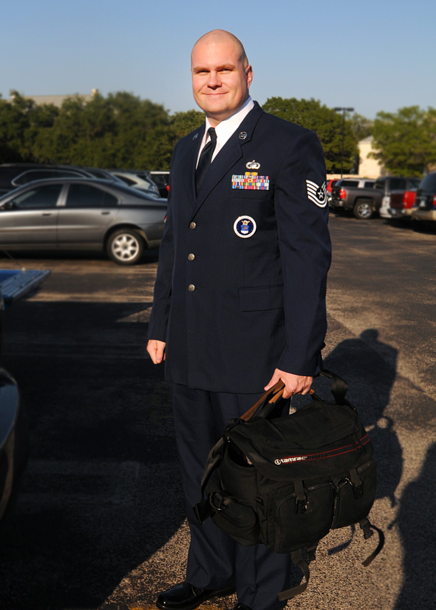 Tech. Sgt. Jeffrey Wolfe, Air Force Recruiting Service national advertising photographer, prepares for a photo shoot. He was awarded second place portrait in the AETC Media Contest.(U.S. Air Force photo/courtesy photo)