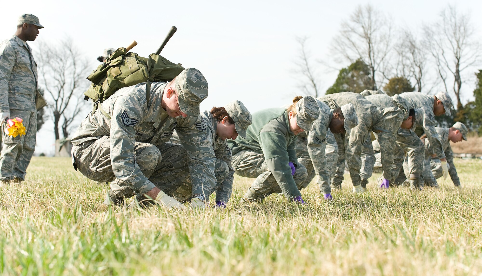 A team from the 436th Force Support Squadron conducts a search here during a Search and Recovery training exercise here in conjunction with Air Force Mortuary Affairs Operations March 22, 2011. (U.S. Air Force photo/Roland Balik)