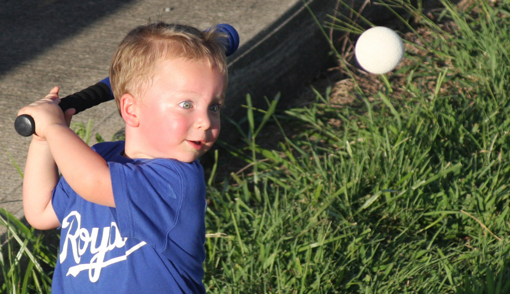 Christian Niederwerder, son of Staff Sgt. Jason Niederwerder, takes aim at the ball during the Third Annual Air Force Sergeants Association Softball Challenge between active-duty and Air Force Reserve Airmen on July 25, 2010, at Wright-Patterson Air Force Base, Ohio.  Staff Sgt. Robert Nelson of the 445th AW Public Affairs Office snapped the photo, which earned him third place in the sports photograph category of the Air Force Media Contest.  (U.S. Air Force photo/Staff Sgt. Robert Nelson)