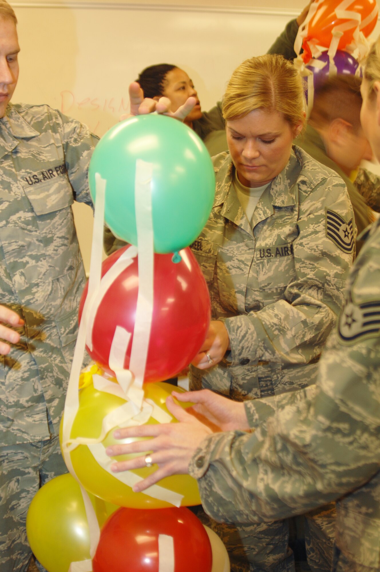 GRISSOM AIR RESERVE BASE, Ind. -- Tech. Sgt. Stephanie Creel, 434th Aerospace Medicine Squadron medical lab technician, attempts to keep her team?s balloon tower stable during an team learning exercise at a noncommissioned officer leadership development course on March 24. The 10-course teaches many leadership qualities through a variety of team exercises and classroom learning.  (U.S. Air Force photo/Senior Airman Damon Kasberg)