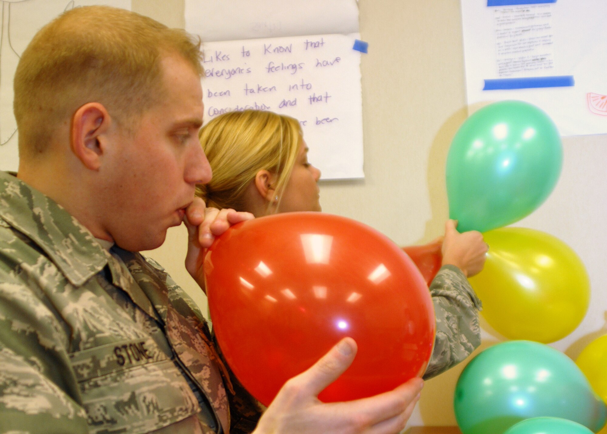 GRISSOM AIR RESERVE BASE, Ind. -- Staff Sgt. Aaron Stone, 434th Logistics Readiness Squadron fuels supply journeyman and Tech. Sgt. Stephanie Creel, 434th Aerospace Medicine Squadron medical lab technician, prepare balloons for a team learning exercise during a noncommissioned officer leadership development course here March 24. The 10-day course is designed to teach Airmen leadership and management qualities that they can implement in the field. During the exercise, four teams were given 25 balloons and a roll of tape as resources to build the tallest balloon tower possible. (U.S. Air Force photo/Senior Airman Damon Kasberg)