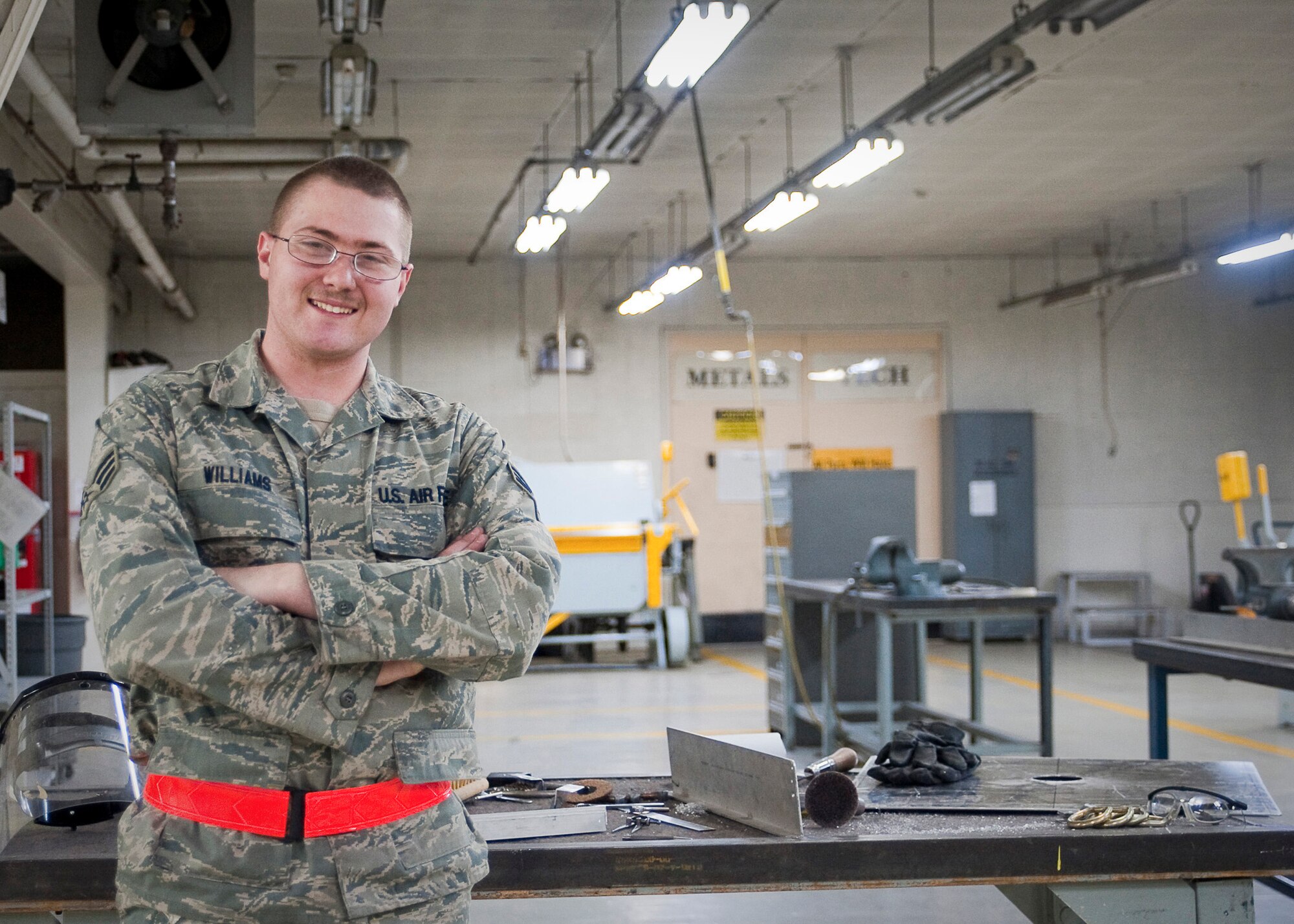 YOKOTA AIR BASE, Japan -- Senior Airman Mark Williams, 374th Maintenance Squadron aircraft structural maintenance technician, stands here at the metals technology shop March 28, 2011. The Oklahoma City, Okla., native is stationed in Japan and is currently supporting Operation Tomodachi, which kicked off at the request of the Government of Japan to support humanitarian relief efforts for those affected by the earthquake tsunami disaster March 11. (U.S. Air Force photo/Airman 1st Class Andrea Salazar)