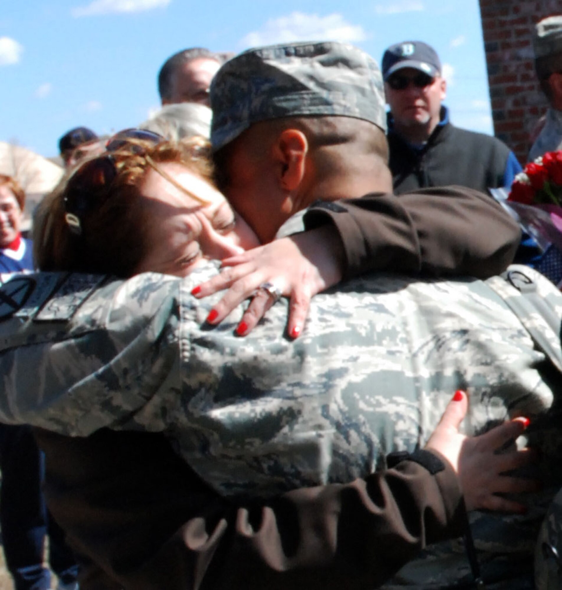 Security Forces from the 439th Airlift Wing were greeted by almost 100 family and fellow reservists as they came home from a 180-day-tour in Afghanistan. Their bus was escorted to the teary-eyed and enthusiastic crowd near the Security Forces building at Westover by the Chicopee Police Department. (US Air Force photo/Master Sgt. Andrew Biscoe)
