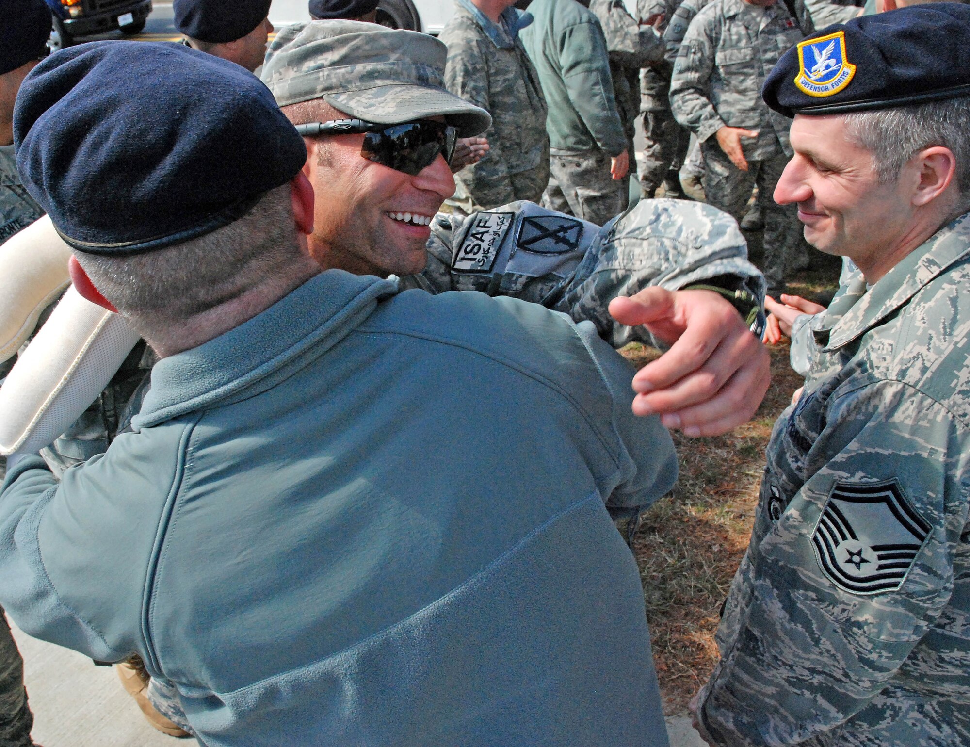 Security Forces from the 439th Airlift Wing were greeted by almost 100 family and fellow reservists as they came home from a 180-day-tour in Afghanistan. Their bus was escorted to the teary-eyed and enthusiastic crowd near the Security Forces building at Westover by the Chicopee Police Department. (US Air Force photo/Master Sgt. Andrew Biscoe)